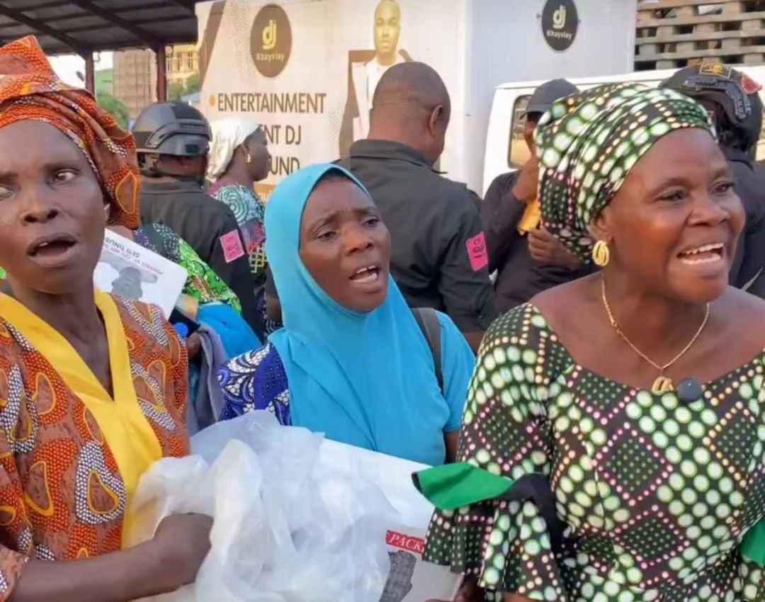 Women pray for Tinubu's 2027 re-election after receiving food from his son